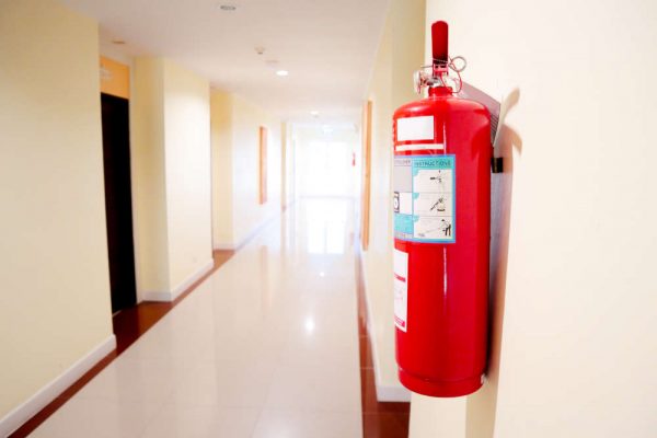 Fire,Extinguisher,Install,Front,Of,The,Room.security,System,Concept.